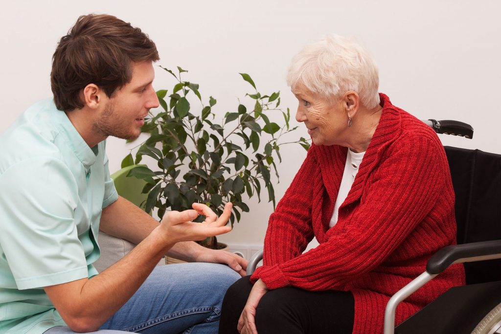 A man and woman talking to each other.